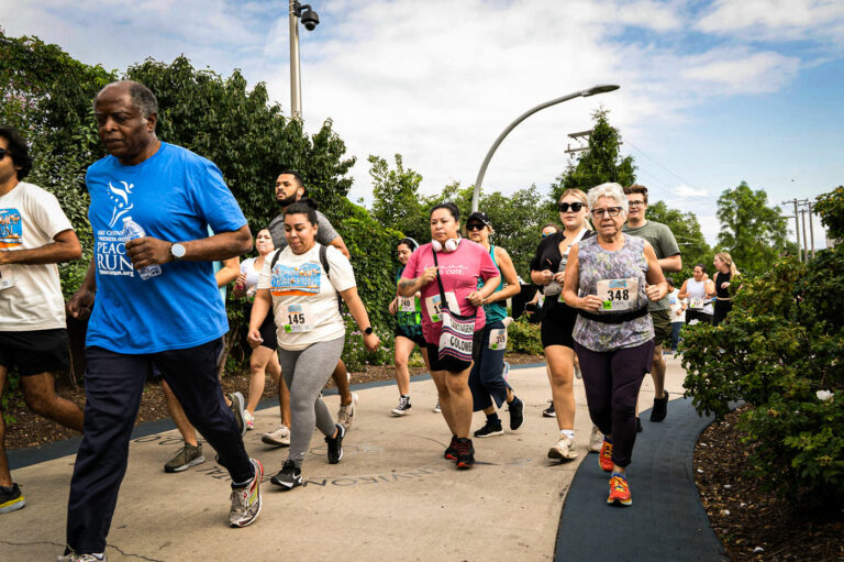 Diverse group of joggers on the Bloomingdale Trail.